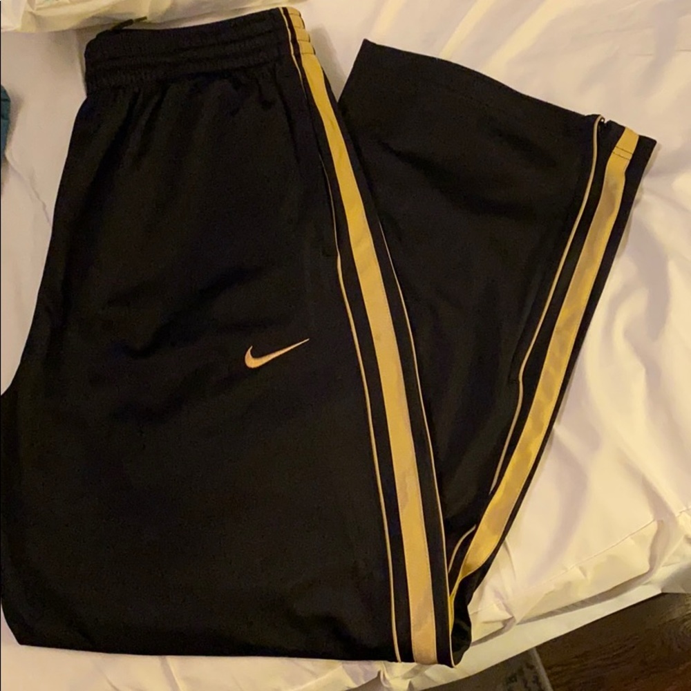 Nike black and gold loose track pants